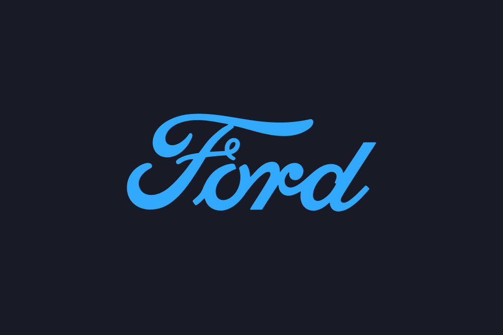 Logo bleu de la marque Ford sur fond sombre.
